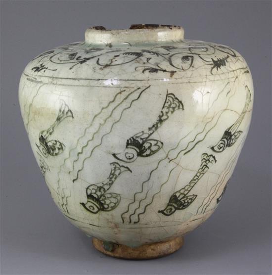 A Kashan pottery ovoid jar, 13th century, height 21.5cm, cracks and losses